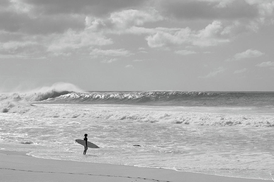 Black And White Photograph - Surfer Standing On The Beach, North #4 by Panoramic Images