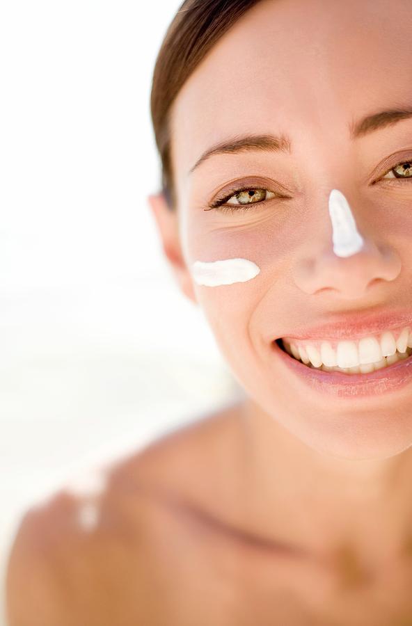 Woman Applying Sunscreen Photograph By Ian Hooton Science Photo Library