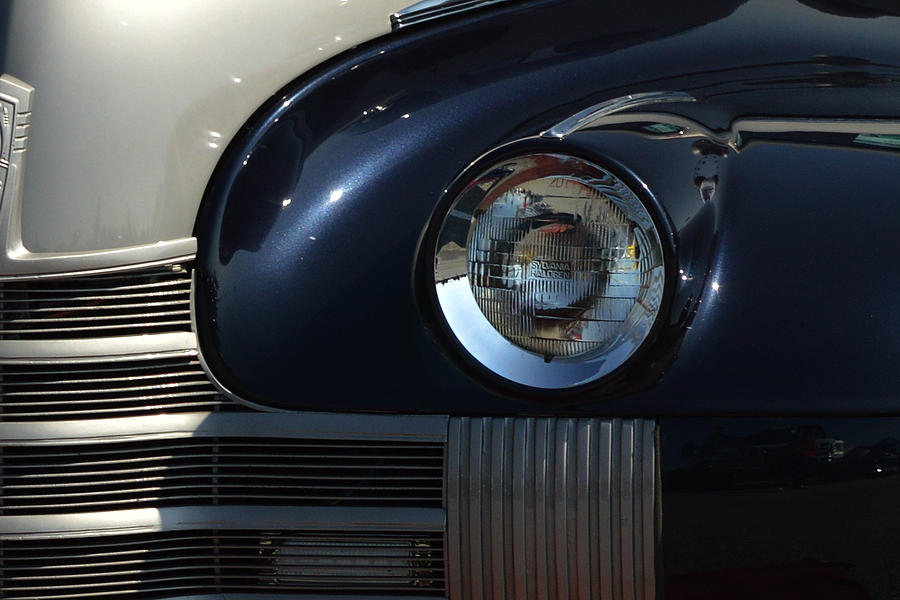 40 Olds Headlight Photograph by Bill Swartwout