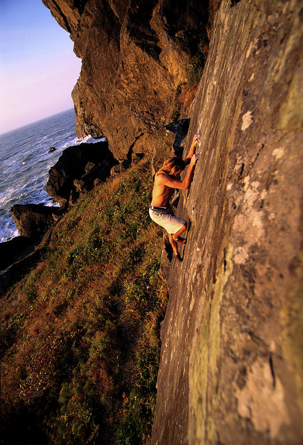 A Man Is Bouldering Near The Ocean Photograph by Bennett Barthelemy ...