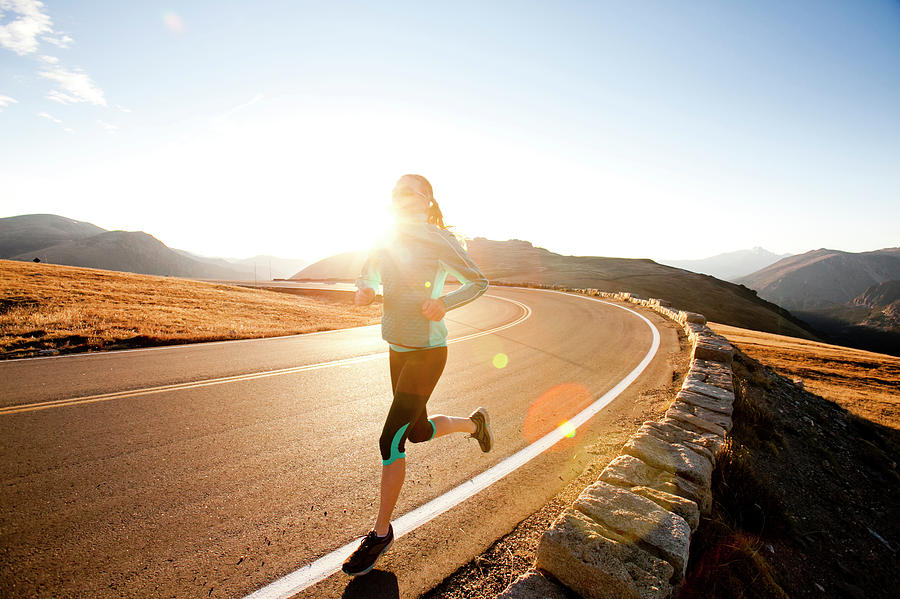 Rocky Mountain National Park Photograph - An Athletic Woman  Runs Along Trail #5 by Steve Glass