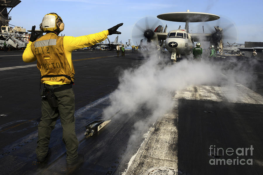 Transportation Photograph - Aviation Boatswains Mate Directs An #5 by Stocktrek Images