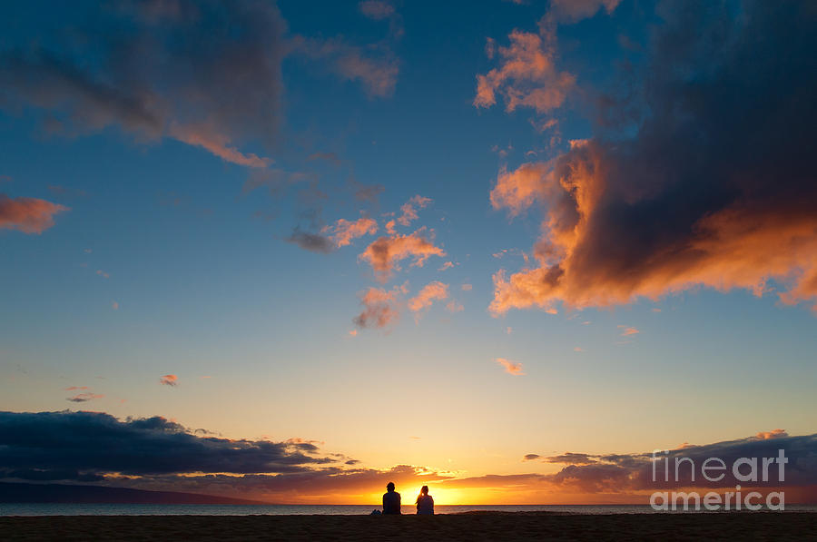 Couple watching the sunset on a beach in Maui Hawaii USA #5 Photograph by Don Landwehrle