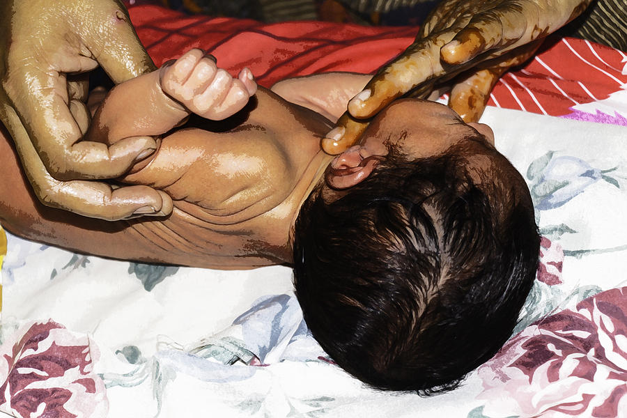 Baby Photograph - 5 day old Indian baby getting a light massage using mustard oil by Ashish Agarwal