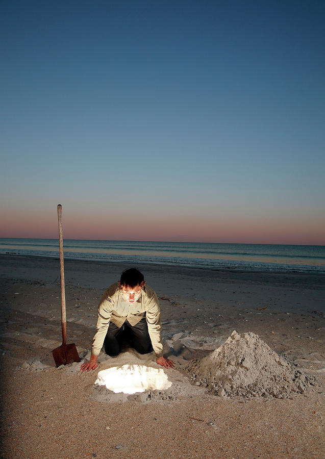 Sunset Photograph - Man Leans Over Glowing Hole In Ground #5 by Logan Mock-Bunting