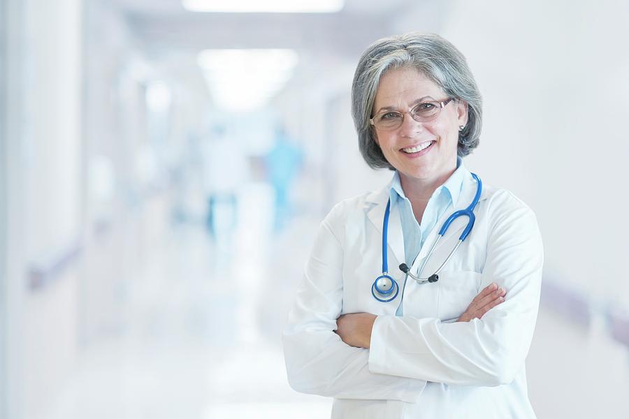 Mature Female Doctor Smiling Photograph By Science Photo Library