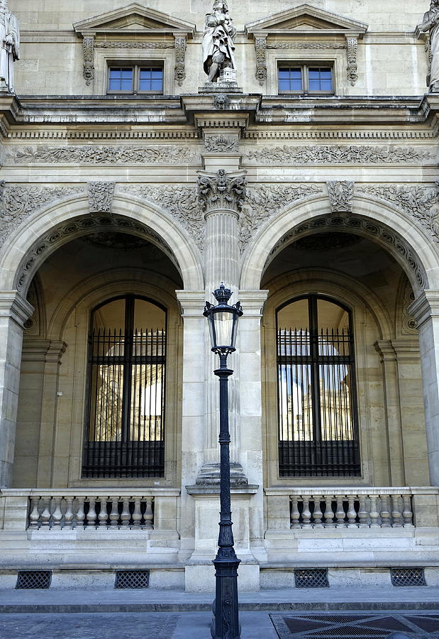 Ornate Architectural Artwork On The Buildings Of The Musee Du Louvre In Paris France Photograph