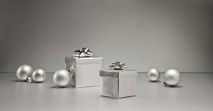 Silver bauble and present #5 Photograph by U Schade