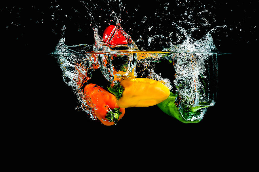 Splashing Paprika #5 Photograph by Peter Lakomy