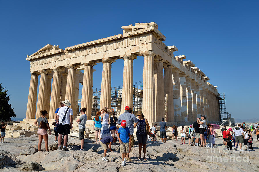 Tourists in Acropolis of Athens in Greece by George Atsametakis.