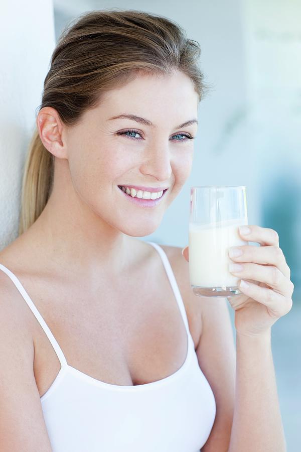 Woman Drinking Milk Photograph By Ian Hooton Science Photo Library Pixels