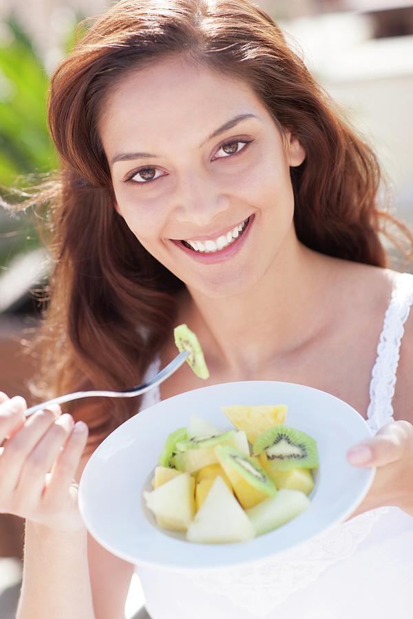 Woman Eating Fruit Photograph By Ian Hootonscience Photo Library