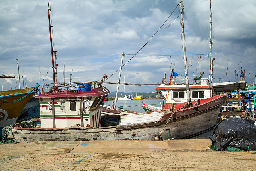 boats in the harbour of Mirissa on the tropical island of Sri Lanka Photograph by Gina Koch
