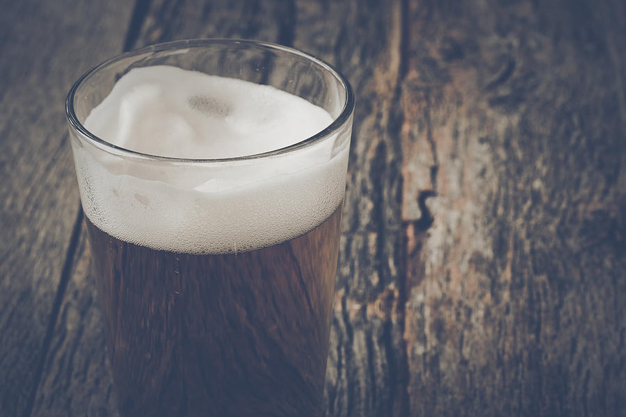 Pint Of Pilsner Beer On Wood Background With Vintage Instagram F Photograph