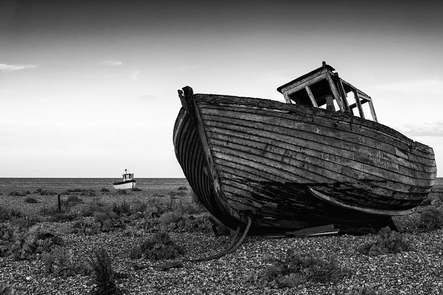 Black And White Photograph - Stunning black and white image of abandoned boat on shingle beac #6 by Matthew Gibson