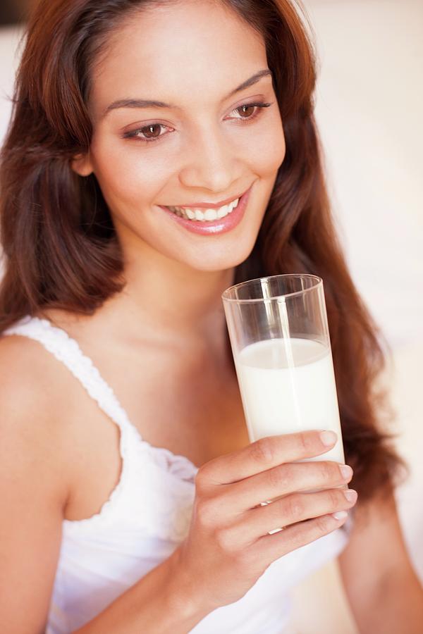 Woman Drinking Milk Photograph By Ian Hooton Science Photo Library