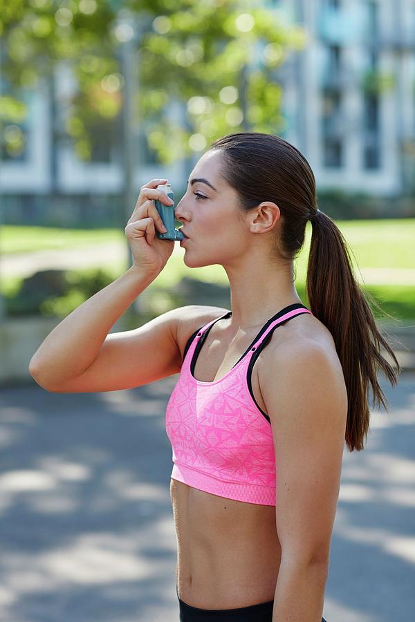 Outdoors Photograph - Young Woman Using Inhaler #6 by Science Photo Library