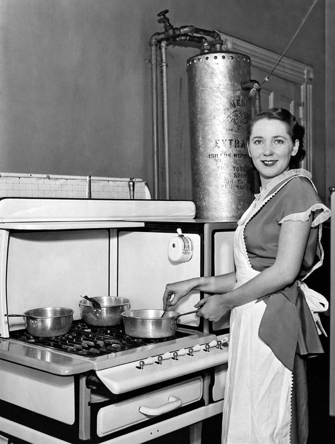 Young Woman Cooking Photograph by Underwood Archives - Fine Art America