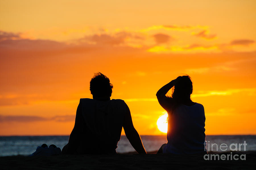 Couple watching the sunset on a beach in Maui Hawaii USA #7 Photograph by Don Landwehrle