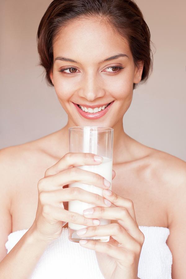 Woman Drinking Milk Photograph By Ian Hooton Science Photo Library