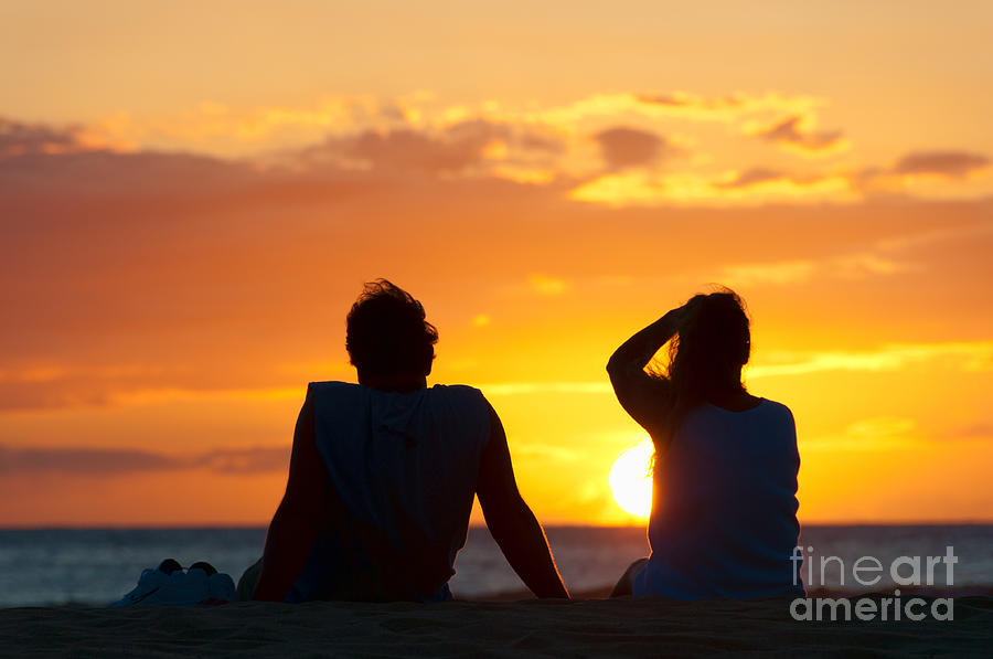 Couple watching the sunset on a beach in Maui Hawaii USA #8 Photograph by Don Landwehrle