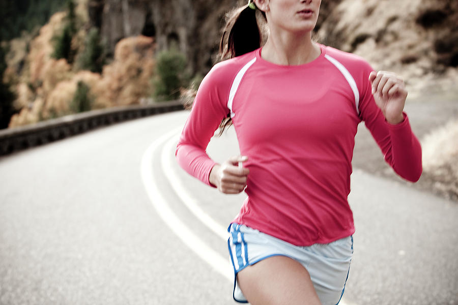 An Athletic Woman Jogging Photograph By Jordan Siemens Fine Art America