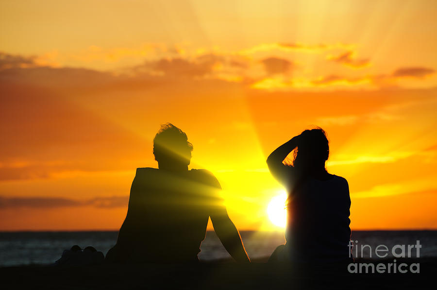 Couple watching the sunset on a beach in Maui Hawaii USA #9 Photograph by Don Landwehrle