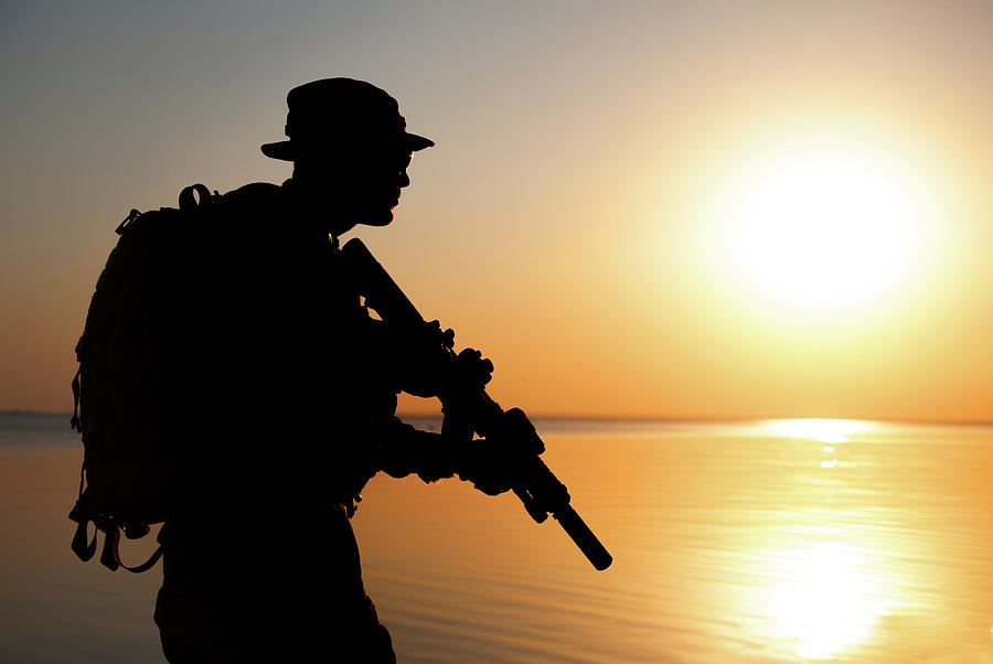 Silhouette Of Army Soldier With Rifle #9 Photograph by Oleg Zabielin