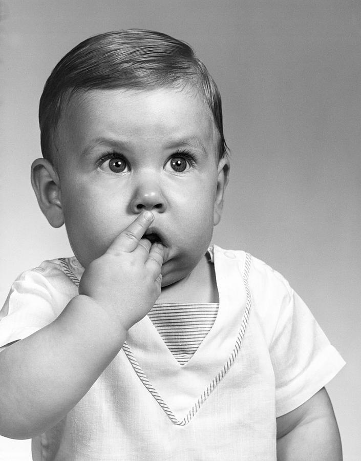 A Baby Looking Expressive Photograph by Underwood Archives - Fine Art ...