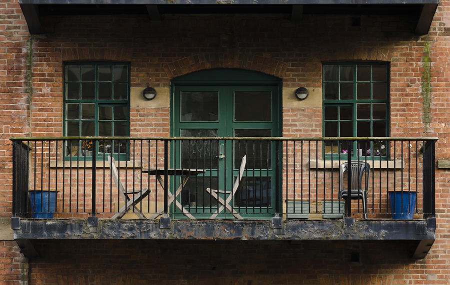 A balcony on the river Aire Photograph by Pablo Lopez