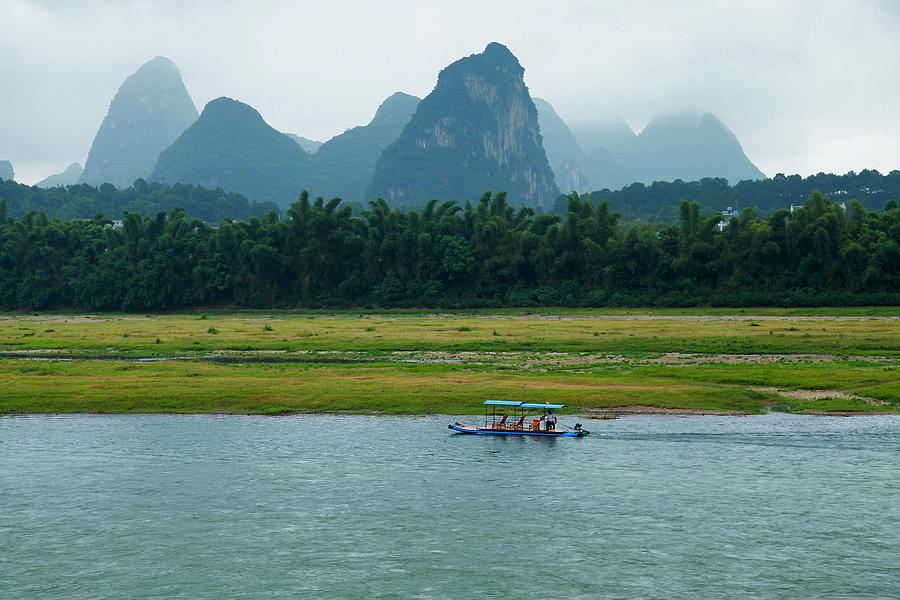 A Bamboo Raft Along The Li River In Photograph by Nisa And Ulli Maier Photography