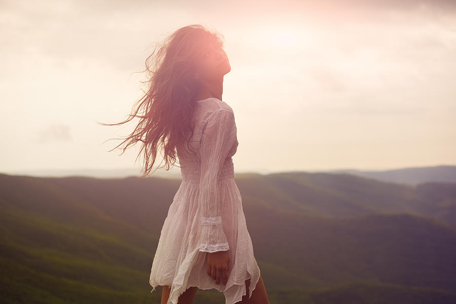 A beautiful woman walking around a mountainside Photograph by Myshkovsky