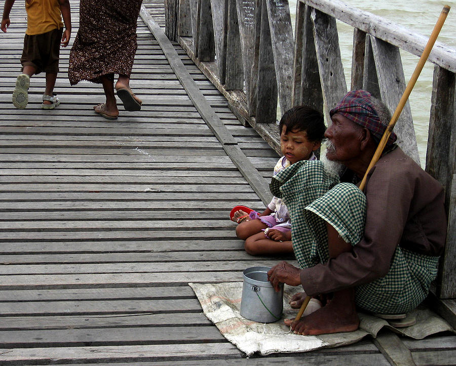 A beggar on the U Bein Bridge Photograph by RicardMN Photography