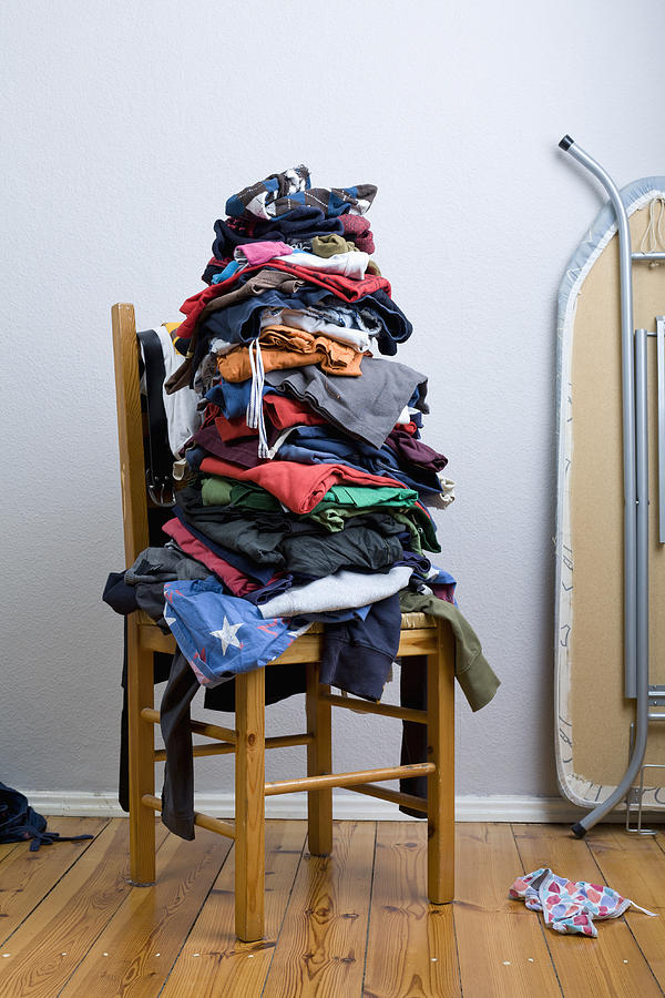 A big untidy stack of clean clothes waiting to be ironed Photograph by Patrick Strattner