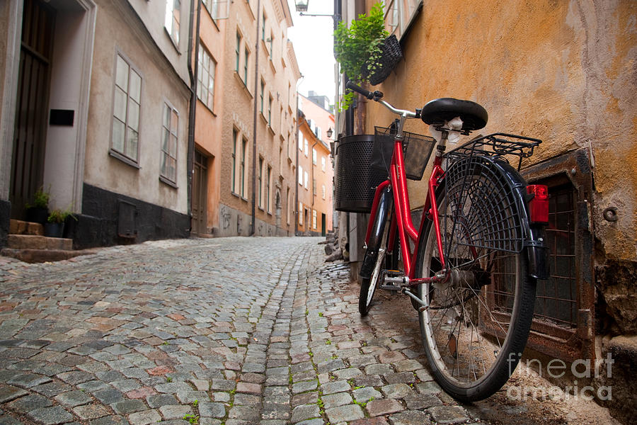 A bike in the old town of stockholm Photograph by Michal Bednarek