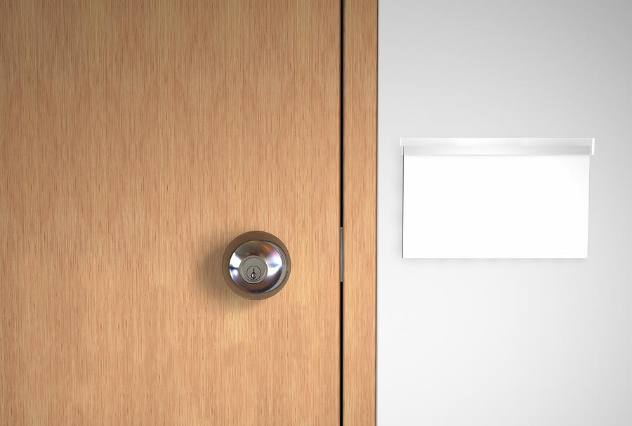 A blank name logo and a stainless door handle on wooden door Photograph by DSGpro