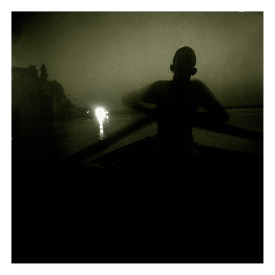 Buddha Photograph - A Boatman Rows His Boat Past The Gats by Simon ODwyer