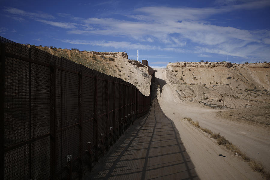 A border fence that separates the U.S. and Mexico Photograph by Bloomberg Creative Photos
