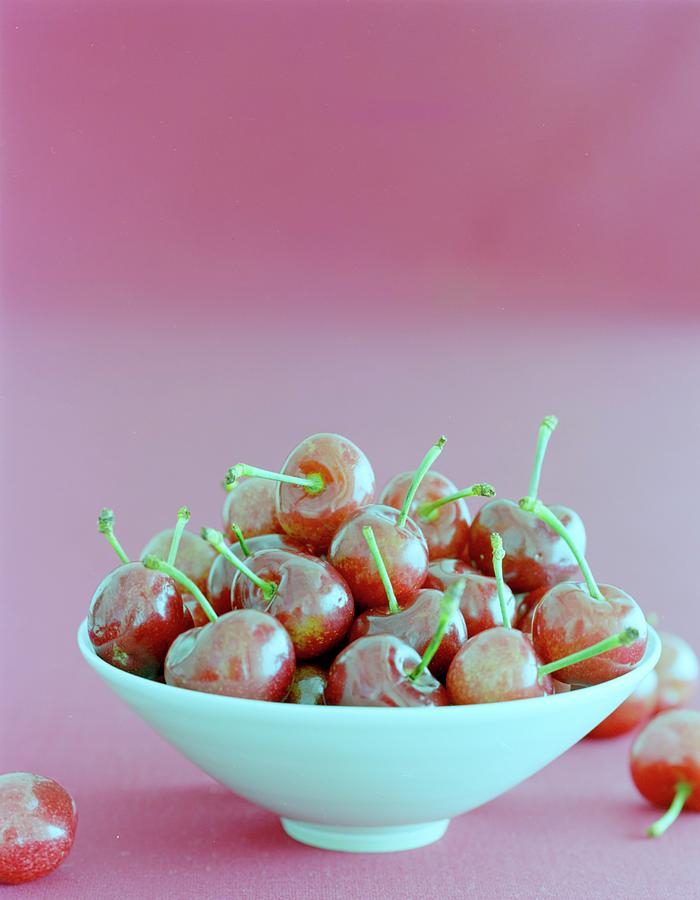 A Bowl Of Cherries Photograph by Romulo Yanes
