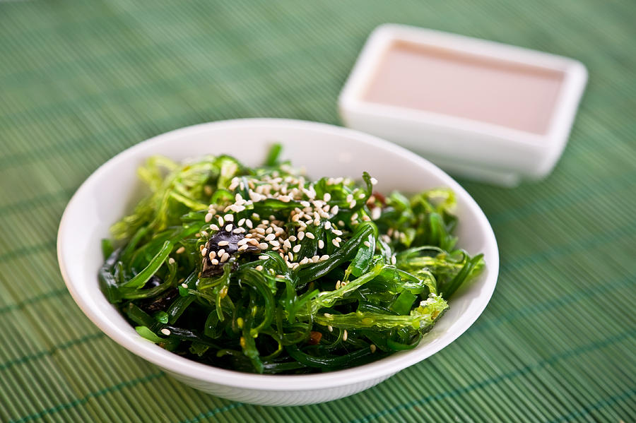 A bowl of Wakame seaweed salad Photograph by Supermimicry
