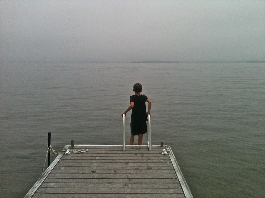 A boy and a lake Photograph by Brooke Friendly