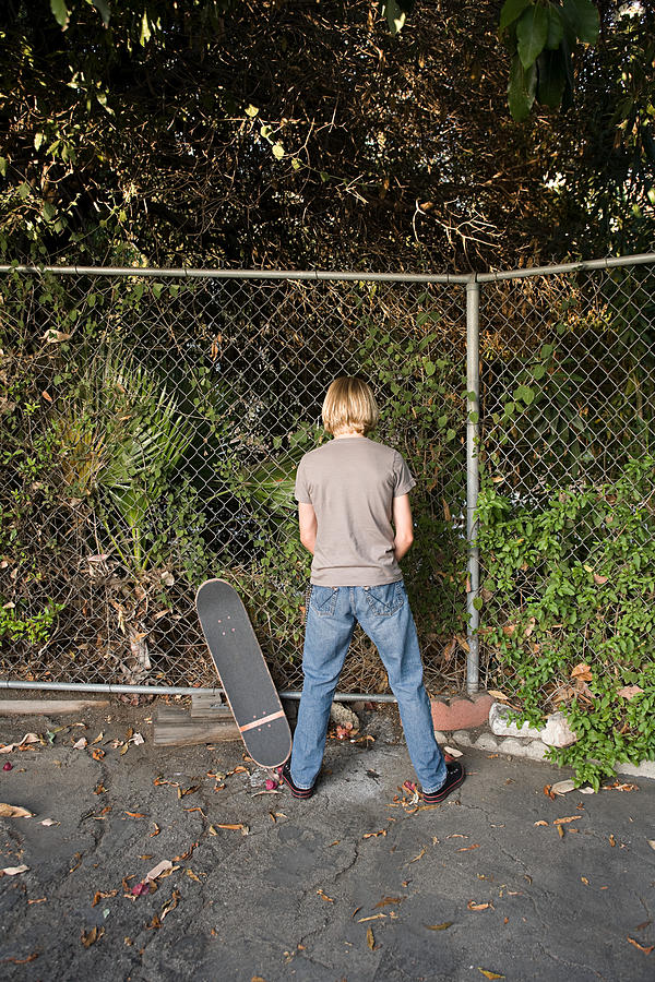A boy urinating Photograph by Image Source