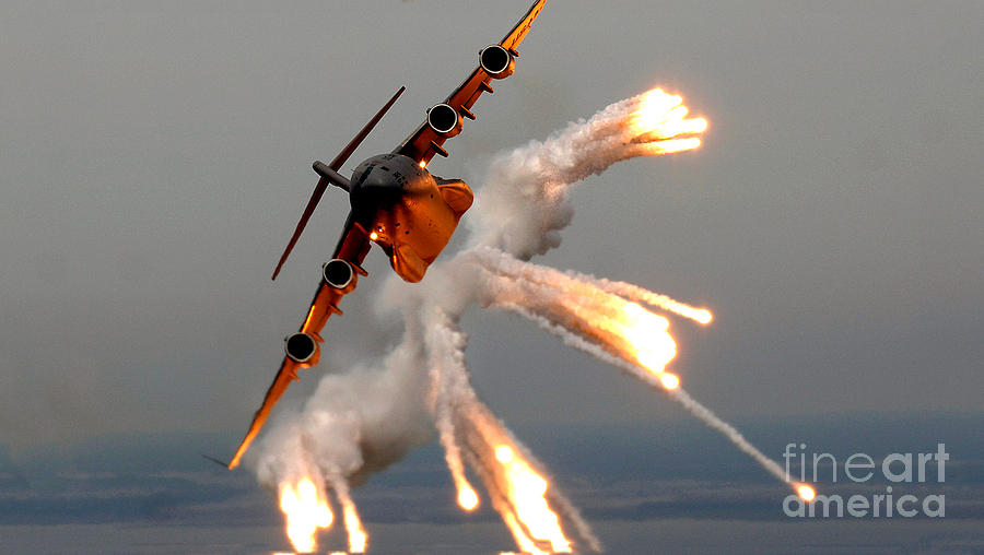 A C-17 Globemaster IIi Releases Flares Photograph