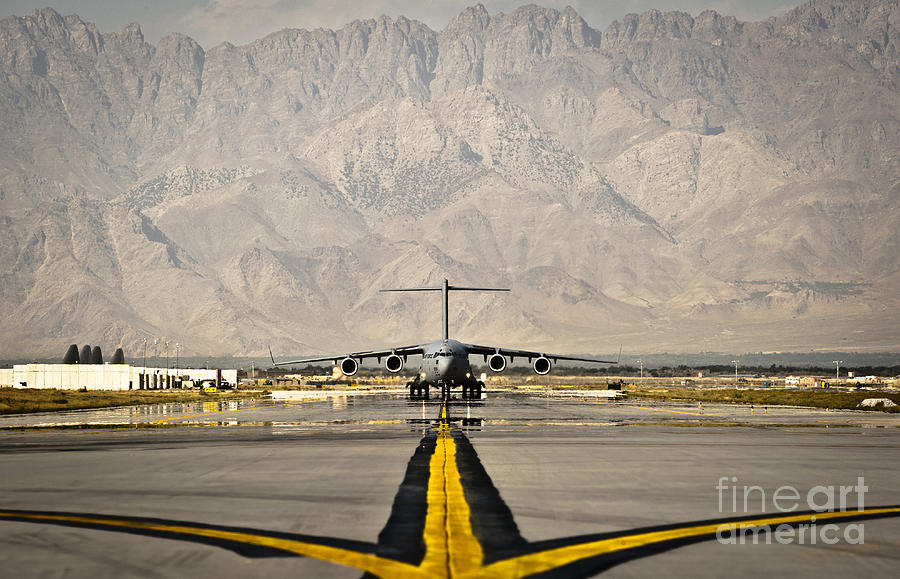 Transportation Photograph - A C-17 Globemaster IIi Taxis by Stocktrek Images