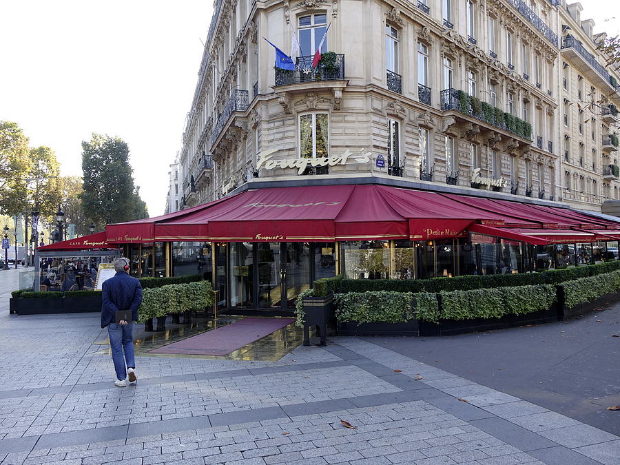 A Cafe On The Champs Elysees In Paris France Photograph by Rick Rosenshein