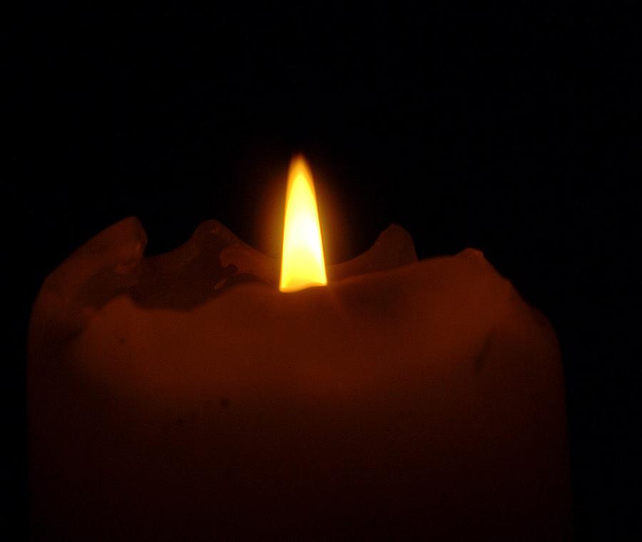 A Candle In The Night Photograph