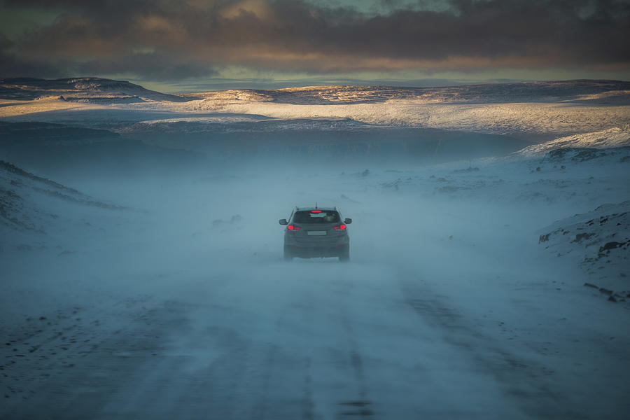 A Car Drive Through Iceland Snow Breeze Photograph by Coolbiere Photograph
