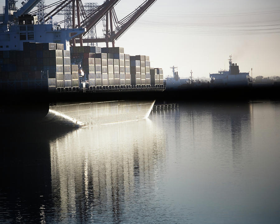 A Cargo Ship At A Loading Dock Photograph by Ron Koeberer - Fine Art ...