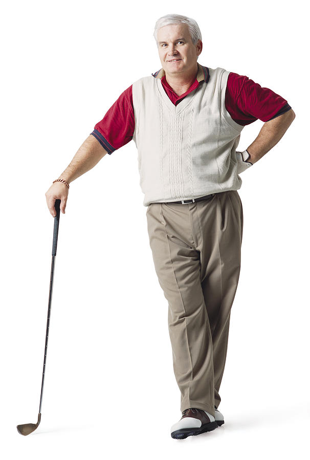 A Caucasian Middle Aged White Haired Man Wearing Red And Tan Is Standing While He Leans On His Club And Smiles Photograph by Photodisc
