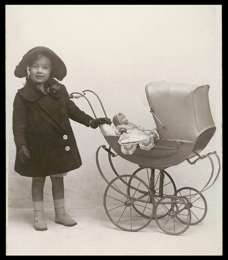 A Child (mandy) With Her Doll In A Pram Photograph by Mary Evans ...